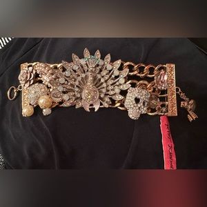 Betsey Johnson peacock and skull statement bracelet.